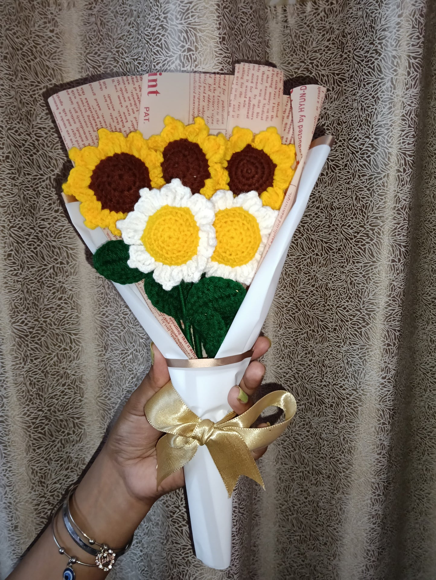 A lovely bouquet of three yellow sunflowers and two white sunflowers, symbolizing happiness, warmth, and peace. Handmade Crosia flowers that never wilt — a perfect gift to brighten someone’s day.